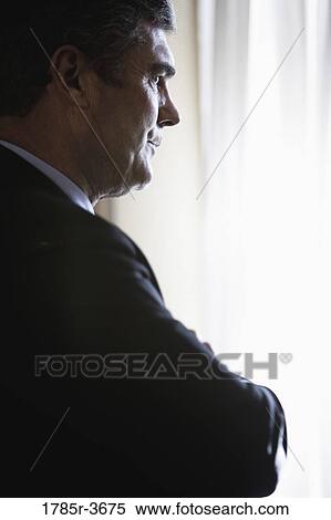 Profile of a businessman in contemplative mood View Large Photo Image Stock Photography - Profile of a businessman in contemplative mood. Fotosearch