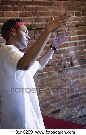Profile of young man gesturing View Large Photo Image Stock Photo - Profile of young man gesturing. Fotosearch