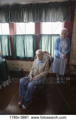 Stock Image - Senior couple in the bedroom. Fotosearch