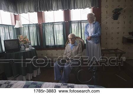 Stock Image - Senior couple in the bedroom. Fotosearch
