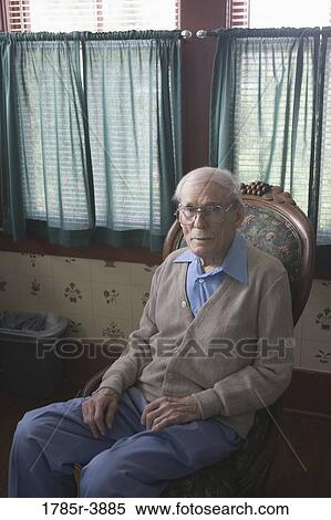 Senior man sitting in chair View Large Photo Image Stock Photography - Senior man sitting in chair. Fotosearch