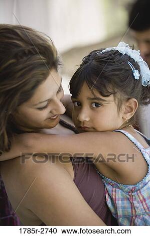 Side view of young woman and young girl View Large Photo Image Stock Image - Side view of young woman and young girl. Fotosearch