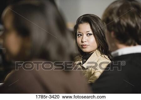 Student conversing with classmates View Large Photo Image Stock Image - Student conversing with classmates. Fotosearch