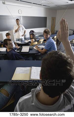 Student raising hand in the classroom View Large Photo Image Stock Image - Student raising hand in the classroom. Fotosearch