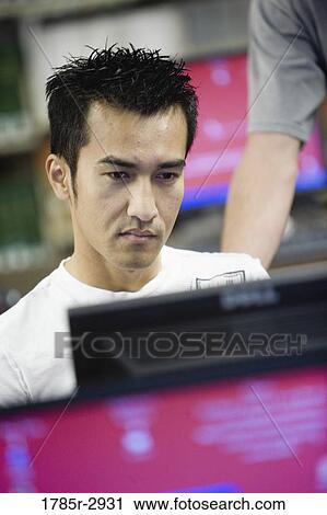 Student sitting in front of computer monitor View Large Photo Image Stock Image - Student sitting in front of computer monitor. Fotosearch