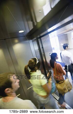 Students exiting an elevator View Large Photo Image Stock Photo - Students exiting an elevator. Fotosearch