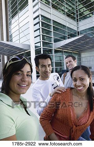 Students hanging out and socializing in front of a building View Large Photo Image Stock Image - Students hanging out and socializing in front of a building. Fotosearch