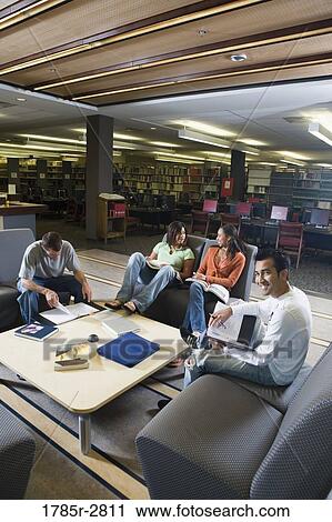 Students in library sitting on sofas studying View Large Photo Image Stock Image - Students in library sitting on sofas studying. Fotosearch