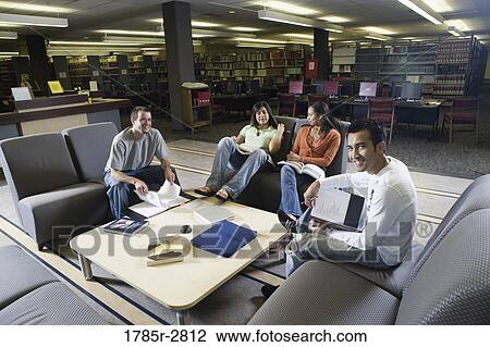 Students in library sitting on sofas studying View Large Photo Image Stock Image - Students in library sitting on sofas studying. Fotosearch