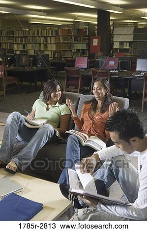 Students in library sitting on sofas studying View Large Photo Image Stock Image - Students in library sitting on sofas studying. Fotosearch