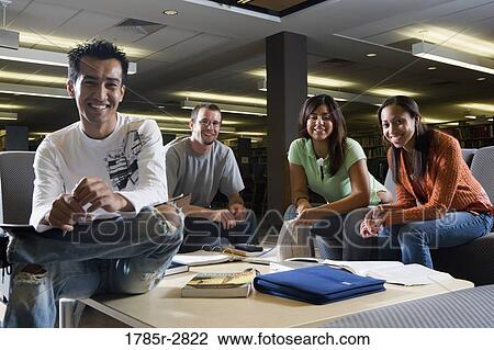 Students in library sitting on sofas studying View Large Photo Image Stock Image - Students in library sitting on sofas studying. Fotosearch