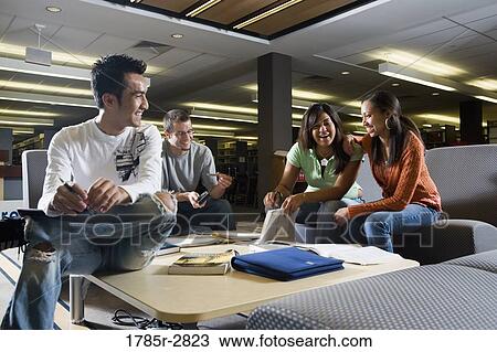 Students in library sitting on sofas studying View Large Photo Image Stock Image - Students in library sitting on sofas studying. Fotosearch