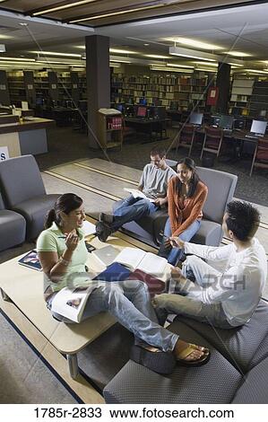 Students in library sitting on sofas studying View Large Photo Image Stock Image - Students in library sitting on sofas studying. Fotosearch