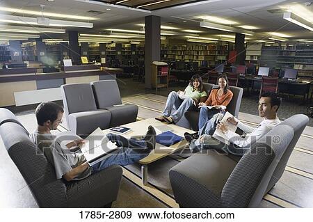 Students in library sitting on sofas studying View Large Photo Image Stock Photo - Students in library sitting on sofas studying. Fotosearch
