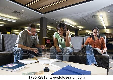 Students in library sitting on sofas studying View Large Photo Image Stock Photo - Students in library sitting on sofas studying. Fotosearch