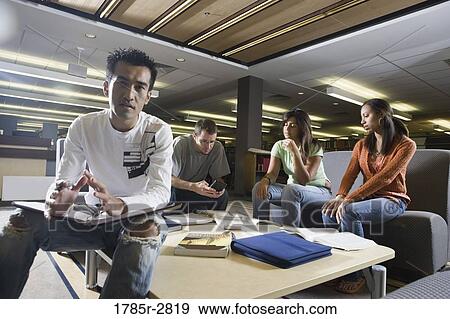 Students in library sitting on sofas studying View Large Photo Image Stock Photo - Students in library sitting on sofas studying. Fotosearch