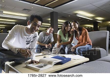 Students in library sitting on sofas studying View Large Photo Image Stock Photo - Students in library sitting on sofas studying. Fotosearch