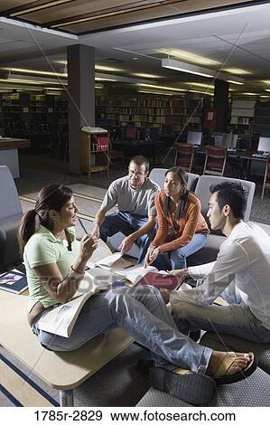 Students in library sitting on sofas studying View Large Photo Image Stock Photo - Students in library sitting on sofas studying. Fotosearch