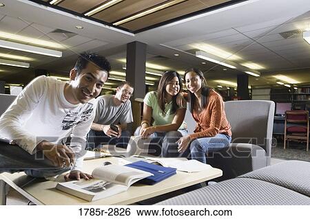 Students in library sitting on sofas studying View Large Photo Image Stock Photograph - Students in library sitting on sofas studying. Fotosearch