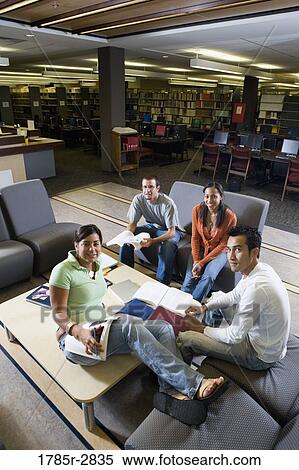 Students in library sitting on sofas studying View Large Photo Image Stock Photography - Students in library sitting on sofas studying. Fotosearch