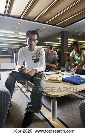 Students in library studying View Large Photo Image Stock Image - Students in library studying. Fotosearch