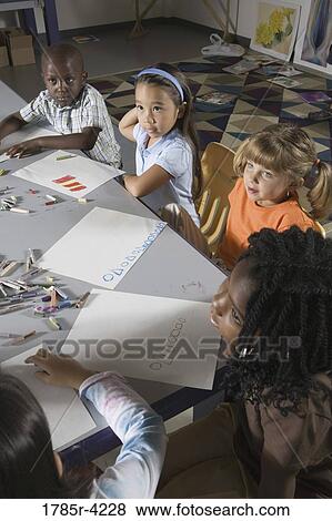 Stock Photo - Students sitting in art class. Fotosearch