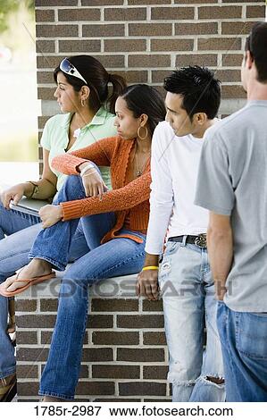 Students sitting together and looking away View Large Photo Image Stock Photo - Students sitting together and looking away. Fotosearch