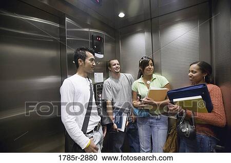 Students standing in an elevator View Large Photo Image Stock Image - Students standing in an elevator. Fotosearch