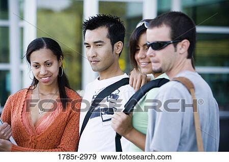 Students standing side by side View Large Photo Image Stock Photo - Students standing side by side. Fotosearch