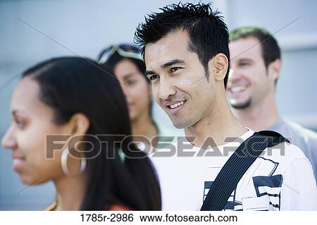 Stock Photograph - Students standing together and smiling. Fotosearch