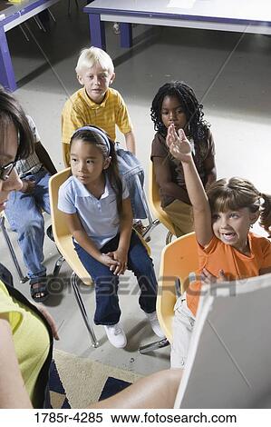 Teacher in classroom teaching young children View Large Photo Image Stock Photography - Teacher in classroom teaching young children. Fotosearch