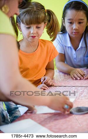 Teacher showing children View Large Photo Image Stock Image - Teacher showing children. Fotosearch