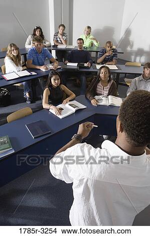Picture - Teacher teaching students in the classroom. Fotosearch