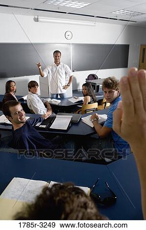 Teacher teaching students in the classroom View Large Photo Image Stock Photo - Teacher teaching students in the classroom. Fotosearch