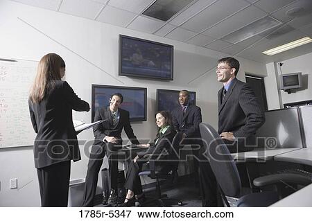 Team meeting in an office View Large Photo Image Stock Photo - Team meeting in an office. Fotosearch