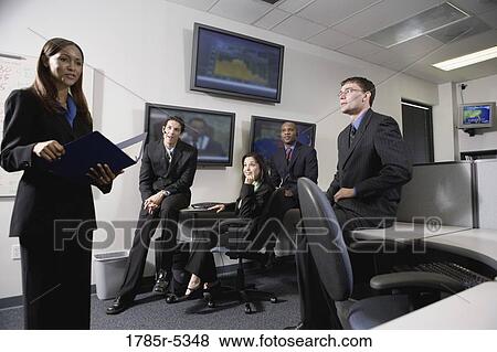 Team meeting in an office View Large Photo Image Stock Photo - Team meeting in an office. Fotosearch