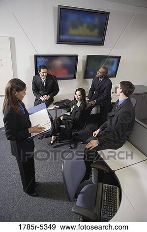 Team meeting in an office View Large Photo Image Stock Photo - Team meeting in an office. Fotosearch
