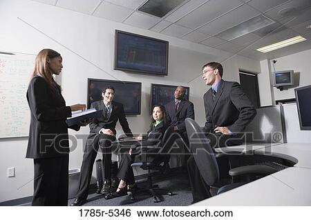 Team meeting in an office View Large Photo Image Stock Photograph - Team meeting in an office. Fotosearch