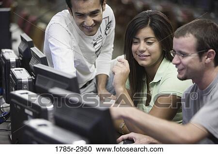 Three university students using computer View Large Photo Image Stock Image - Three university students using computer. Fotosearch