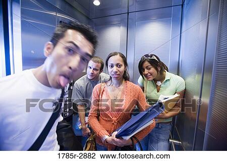 University students in elevator making funny faces View Large Photo Image Stock Image - University students in elevator making funny faces. Fotosearch