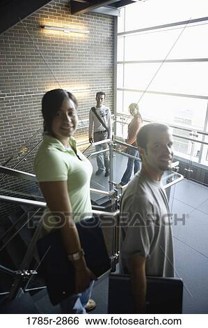 University students standing on stairway between classes View Large Photo Image Stock Photograph - University students standing on stairway between classes. Fotosearch