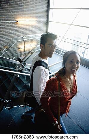 University students walking downstairs between classes View Large Photo Image Stock Image - University students walking downstairs between classes. Fotosearch
