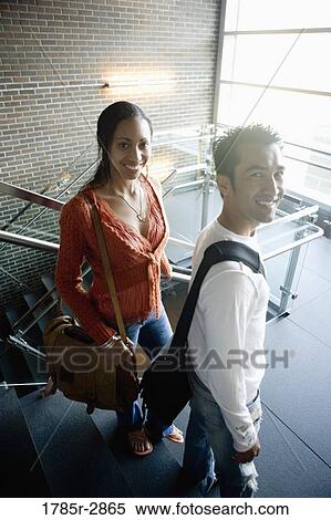 Stock Photography - University students walking downstairs between classes. Fotosearch