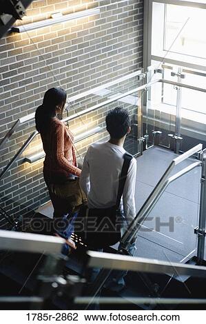 University students walking upstairs between classes View Large Photo Image Stock Image - University students walking upstairs between classes. Fotosearch