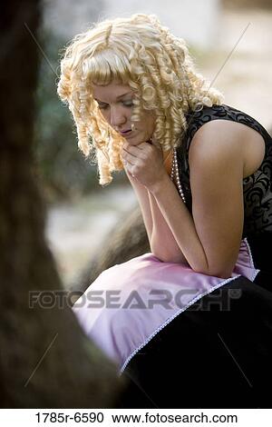 View of a lost and frightened princess in a purple gown View Large Photo Image Stock Image - View of a lost and frightened princess in a purple gown. Fotosearch