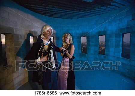 View of a navy officer and a princess standing in a castle turret View Large Photo Image Stock Photograph - View of a navy officer and a princess standing in a castle turret. Fotosearch