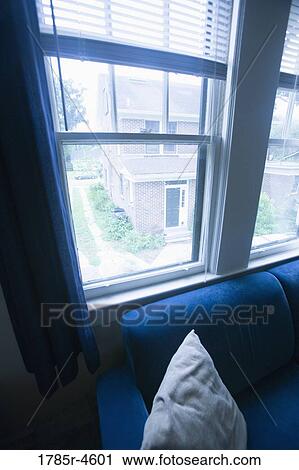 View of a neighboring house through a window View Large Photo Image Stock Image - View of a neighboring house through a window. Fotosearch