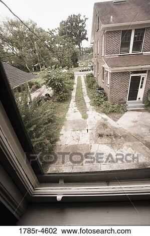 View of a neighboring house through a window View Large Photo Image Stock Image - View of a neighboring house through a window. Fotosearch