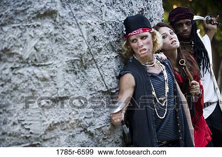 View of armed pirates sneaking around a castle wall View Large Photo Image Stock Photo - View of armed pirates sneaking around a castle wall. Fotosearch