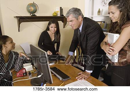 Picture - Women entrepreneurs in a business meeting. Fotosearch